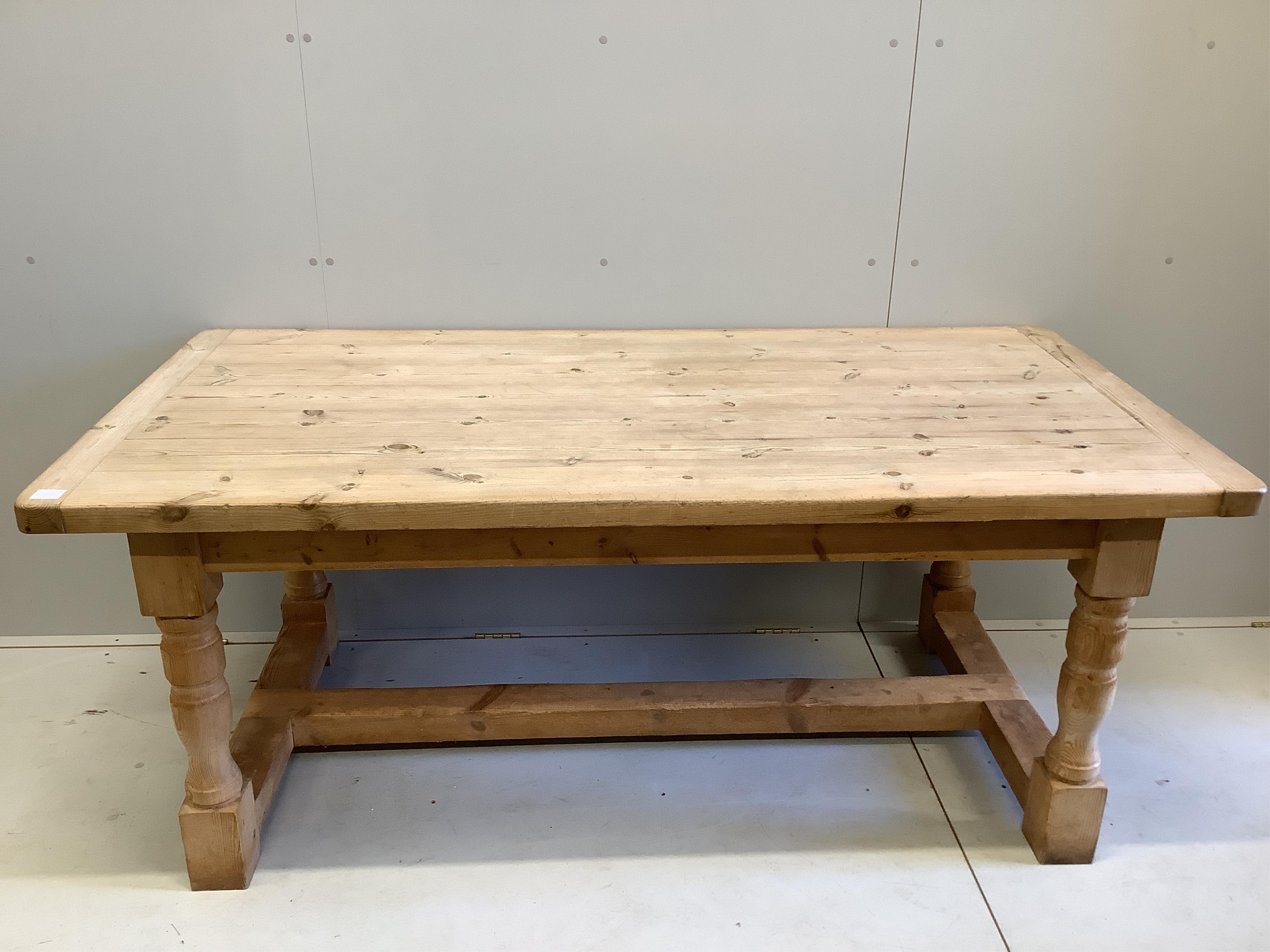 An 18th century style rectangular pine refectory dining table, width 182cm, depth 91cm, height 74cm. Condition - fair